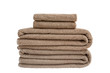 Brown bath towels in stack isolated over white