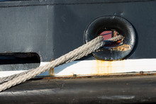 Ropes Tying A Ship To The Dock In Port