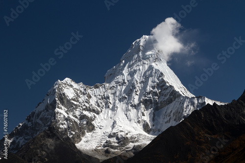 фотография Silhouette of a tree on a background of mountains in Nepal
