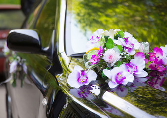 Luxury wedding car decorated with flowers