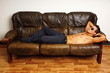 © petrdlouhy - Young athlete man in sunglasses lying on couch relaxes