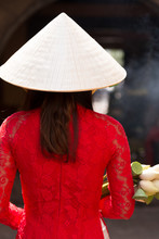 Woman In Ao Dai Dress And Conical Hat