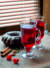 Two Glasses Of Mulled Wine With Red Hearts