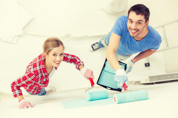 Sticker - smiling couple painting wall at home