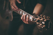 © fesenko - man playing guitar no face