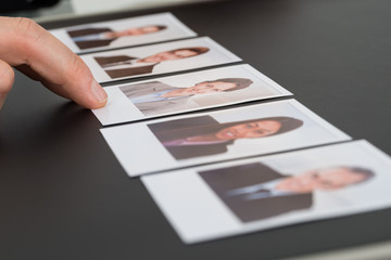 Person Choosing Photograph Of A Candidate