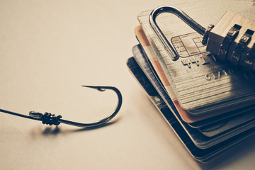 Wall Mural - credit card phishing - lock on credit cards with a fish hook