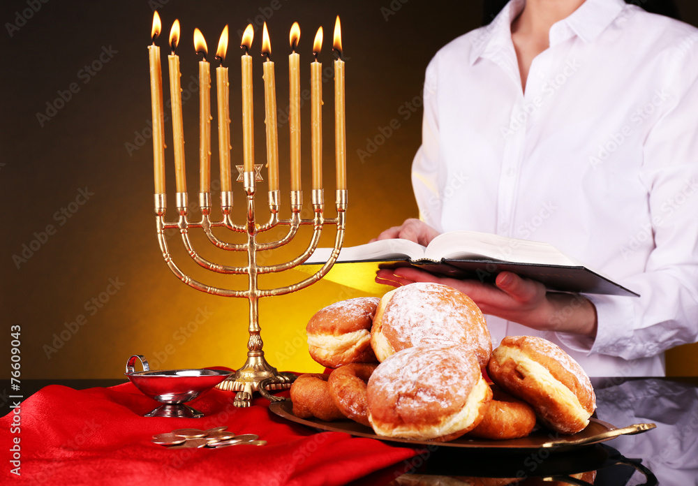 Festive ceremony on Hanukkah on dark background