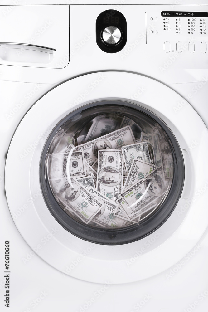 Money in washing machine, closeup view