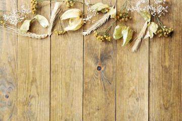 Sticker - Dried wheat on rustic wooden planks background