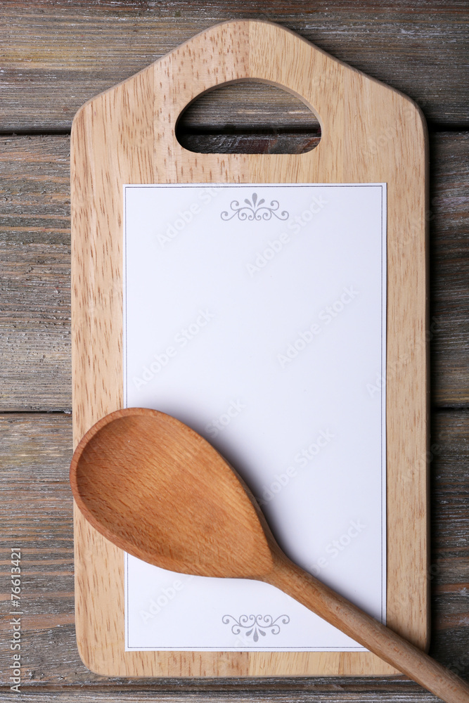 Cutting board with menu sheet of paper