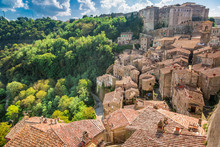View Of A Green Valley In Sorano Over Red Roofs, Italy