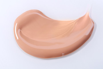 Smeared Liquid Beige Make Up Foundation on White Background