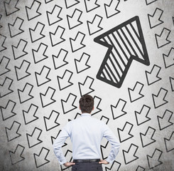 Wall Mural - Businessmen looking on falling arrows