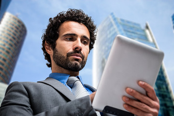 Wall Mural - Businessman using a tablet computer