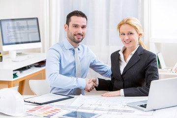 Engineer and architect working at the office