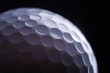 © shefkate - A close-up of a golf ball over dark background