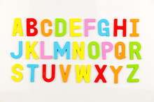 Alphabet magnets on whiteboard