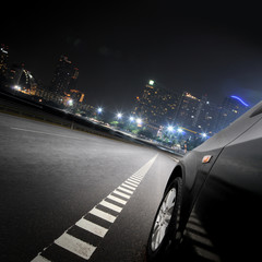 City at sunset with light trails