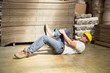 © WavebreakmediaMicro - Worker lying on the floor in warehouse