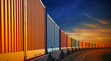 Fototapeta Sport - wagon of freight train with containers on the sky background