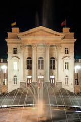 Wall Mural - Fountain on the background of the historic buildings at night