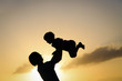 © nadezhda1906 - father and son silhouettes play at sunset