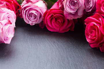 red and pink  roses  frame on table