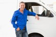 © WavebreakmediaMicro - Smiling man leaning against his delivery van