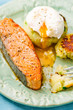 the fried salmon with a potato patty and poached egg
