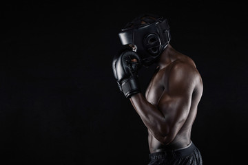 Wall Mural - African male boxer blocking his face with gloves