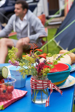 Wild Flowers Decorating Table On Family Camping Holiday
