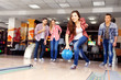 © Africa Studio - Friends playing in bowling club