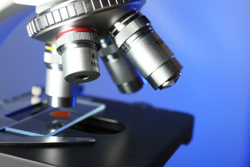 Wall Mural - microscope on color background, close-up