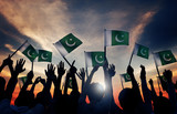 Fototapeta  - Group of People Waving Flag of Pakistan in Back Lit