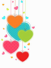 Wall Mural - Colorful hanging hearts for Happy Valentines Day celebration.