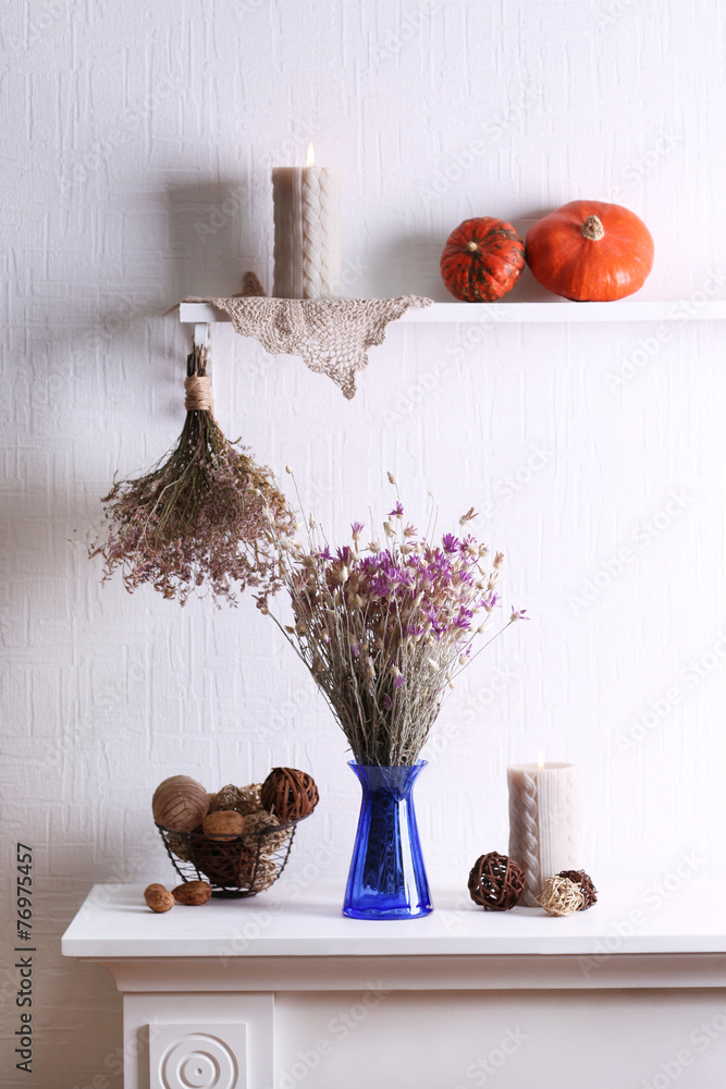 Composition of dried flowers on white wall background