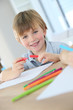 © goodluz - Portrait of smiling 6-year-old boy making drawing