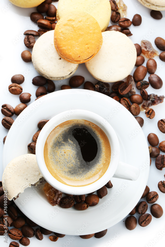 Gentle colorful macaroons and black coffee in mug