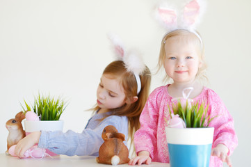 Wall Mural - Two sisters wearing bunny ears on Easter