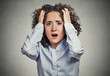 stressed, frustrated shocked business woman pulling hair out