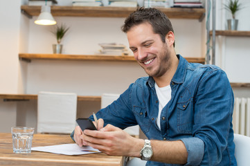 Man relaxing with mobile phone