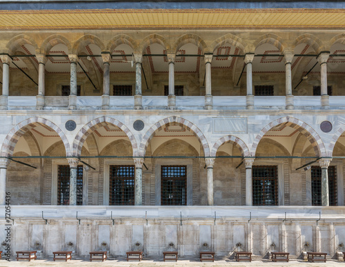 Fotografia, Obraz Front view of corridor and fountains for ritual ablution