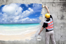 Worker With Paint Brushes Drawing Summer Beach On The Wall