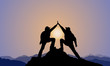 silhouette of 2 men,mountain top ,sunset