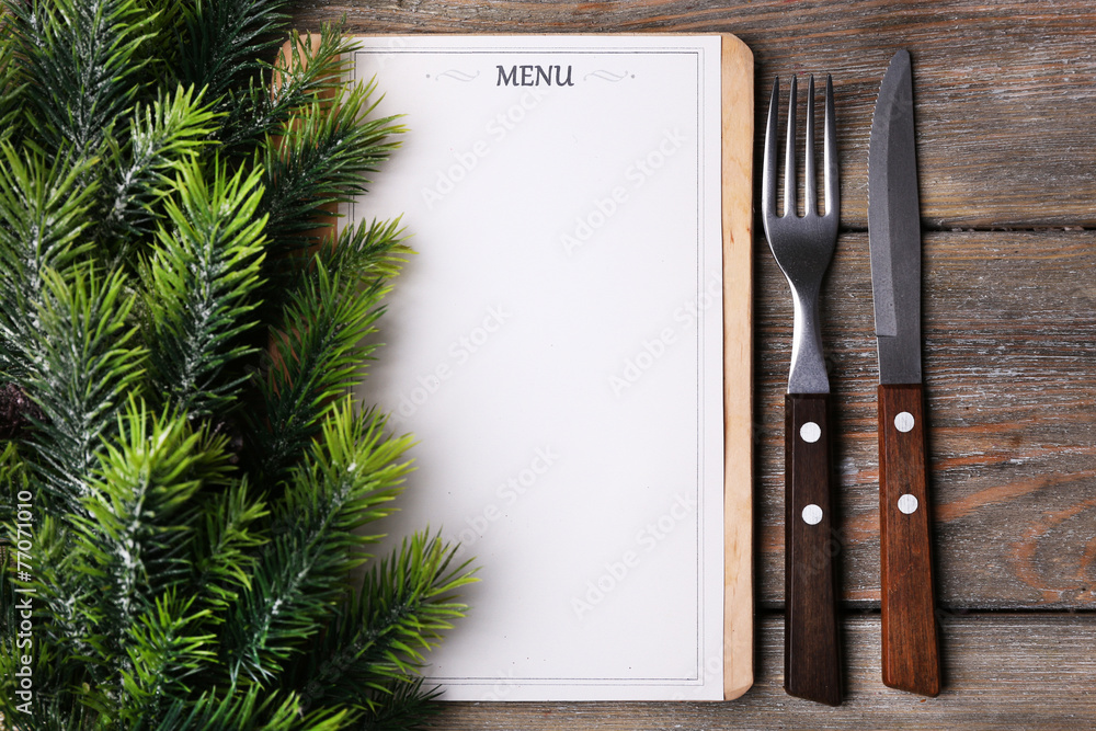 Menu board with Christmas decoration on wooden planks