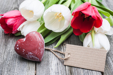 Wall Mural - Bouquet of tulips with an empty tag and red heart