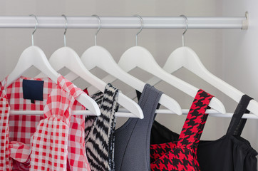 row of dress hanging on coat hanger