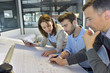 © goodluz - Team of architects working on construction project