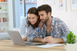 © goodluz - Couple at home websurfing on internet
